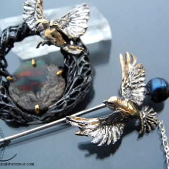 silver brooch with black opal and nightingales